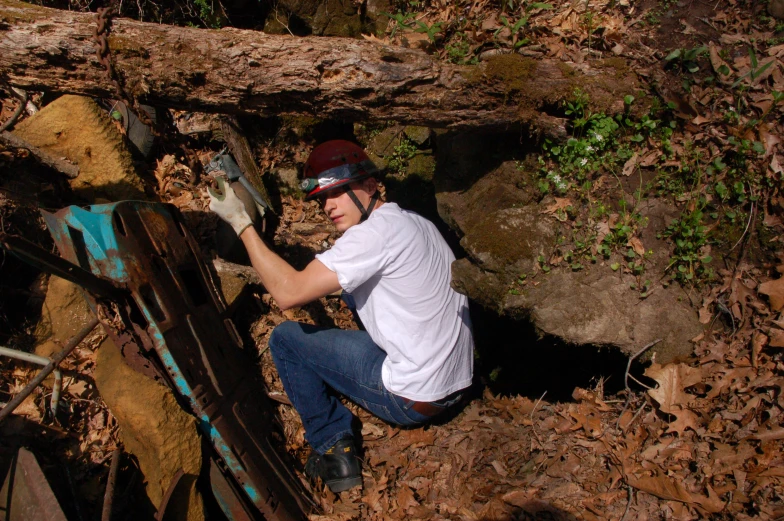 a man is removing down some fallen trees