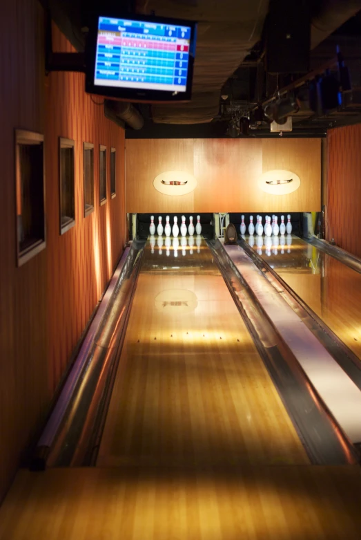 a bowling alley is empty except for the lanes