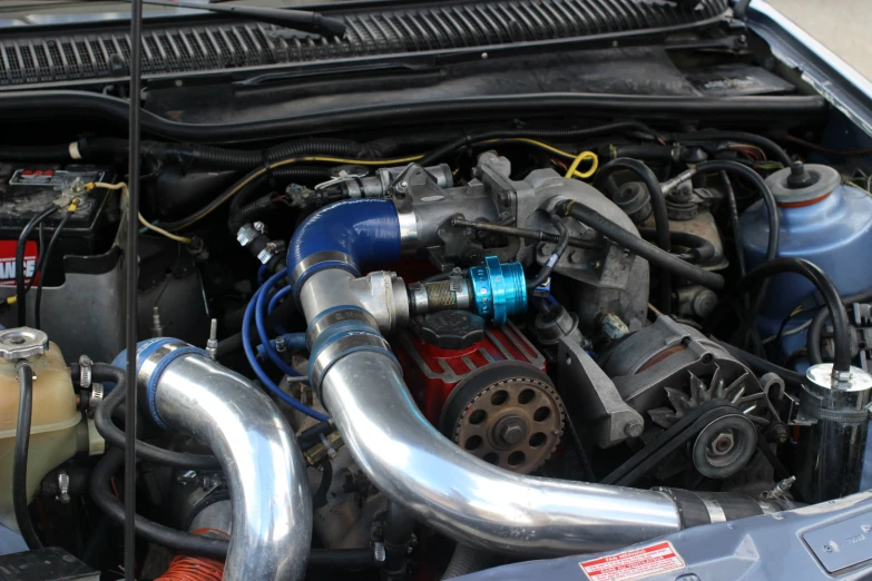 engine of car with hoses, valves and parts installed