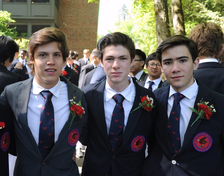 a group of young men in suits and ties