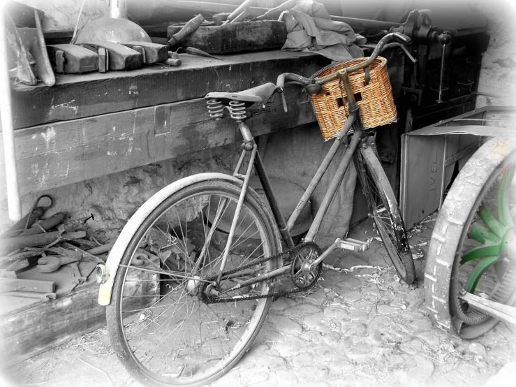 the old bicycle is leaned up against a building