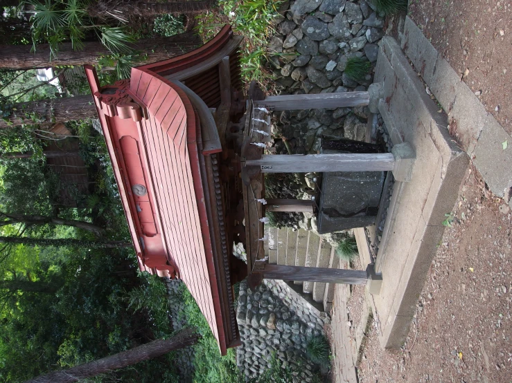 an asian shrine in the middle of a jungle