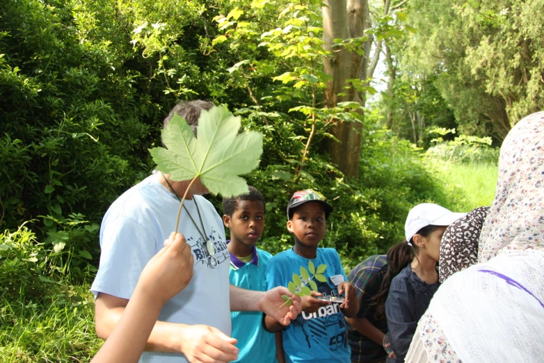 some children are getting ready to plant soing