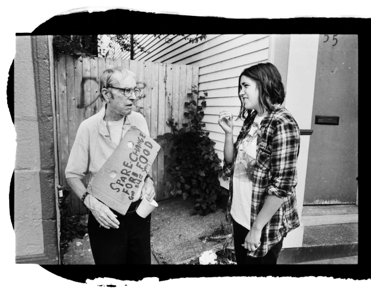 a man and a woman holding a box