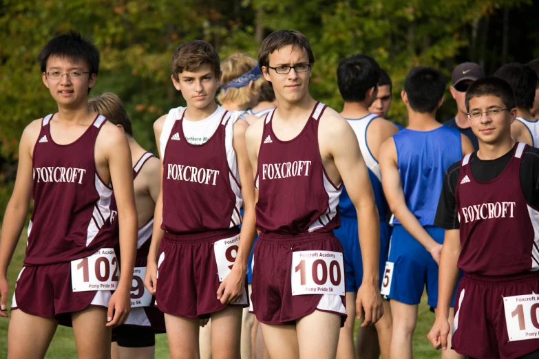 a group of young men are on a field