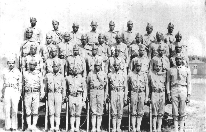 a group of men in uniforms standing next to each other