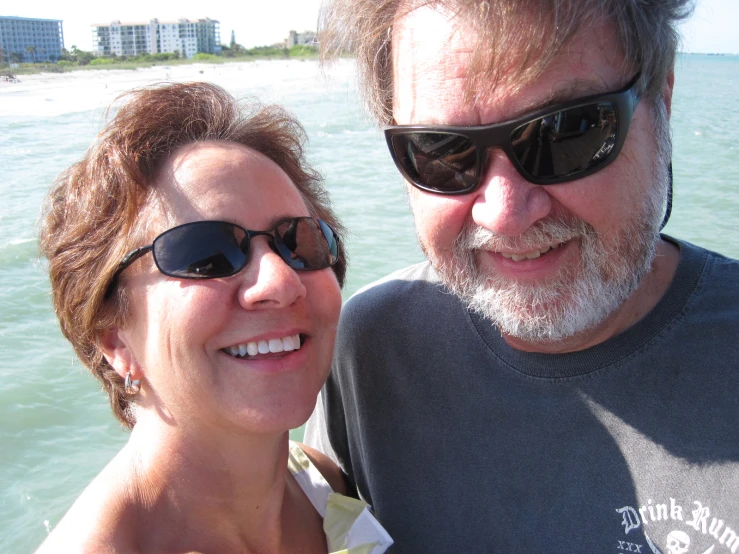 a couple on a boat smiling for the camera