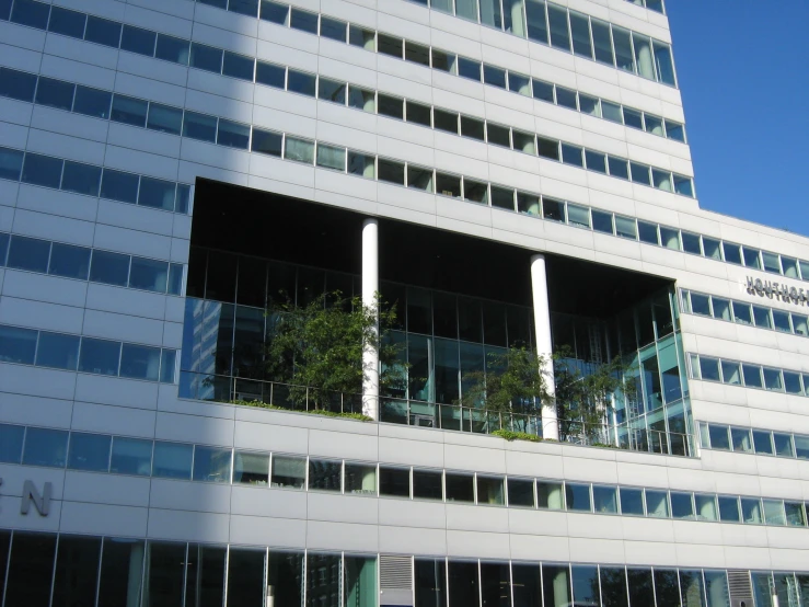an office building with vertical vertical glass windows