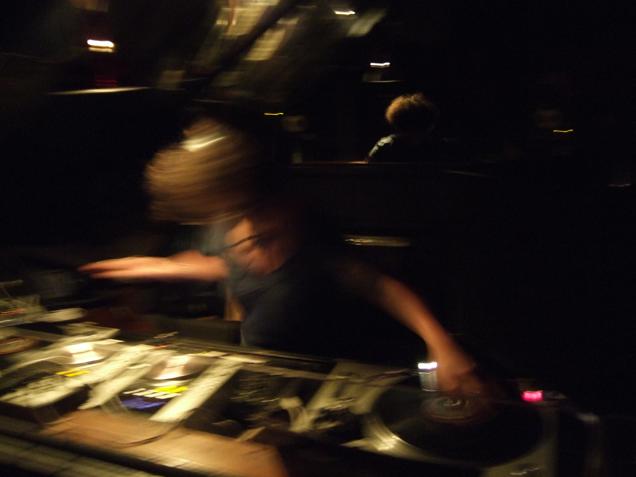 a dj spinning music records with the focus on it