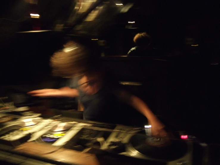 a dj spinning music records with the focus on it