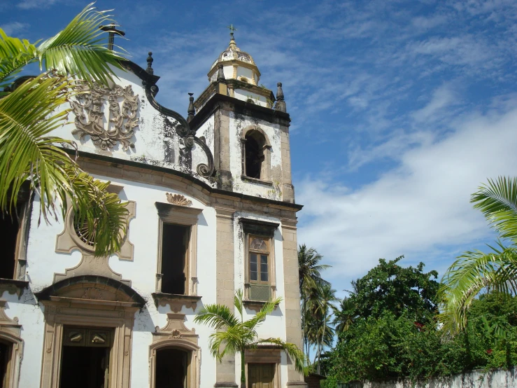 a building with a steeple with a clock tower