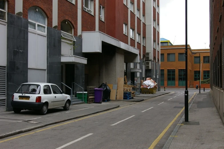 there is a car parked in front of the building