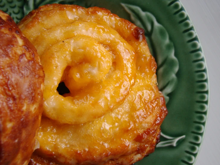 two puff pastry on a plate together on a table