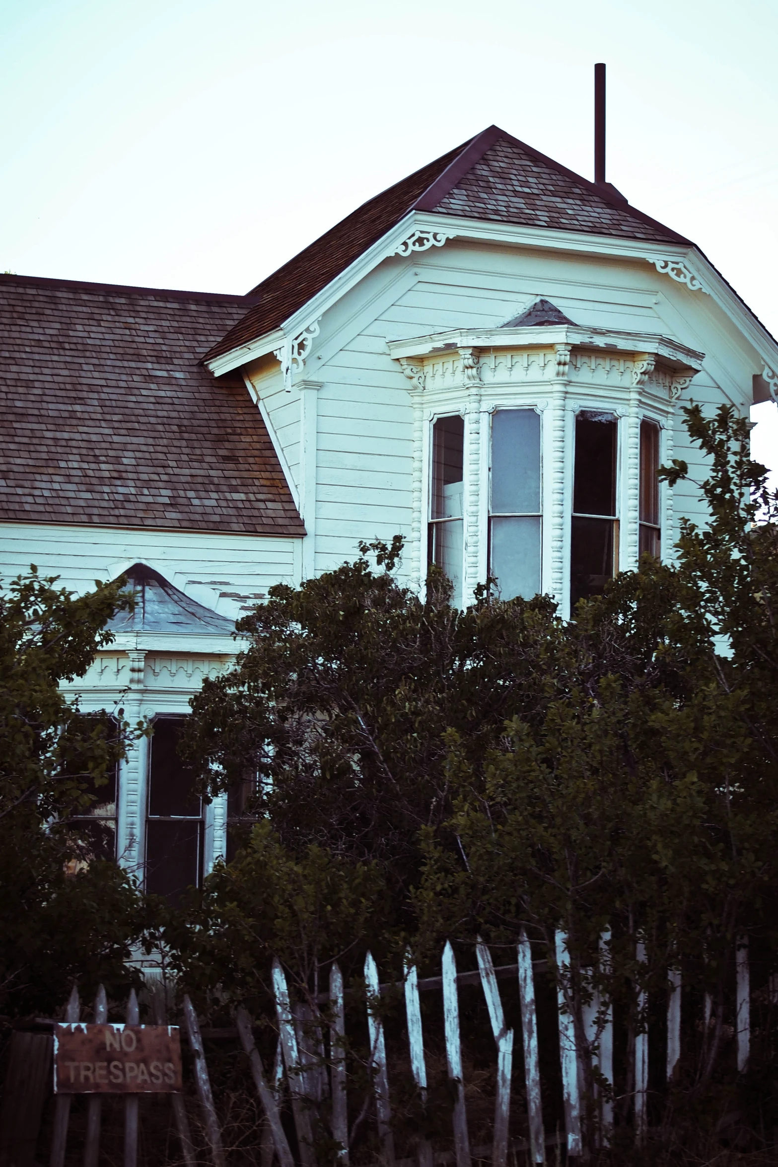 the house has a wooden fence around it