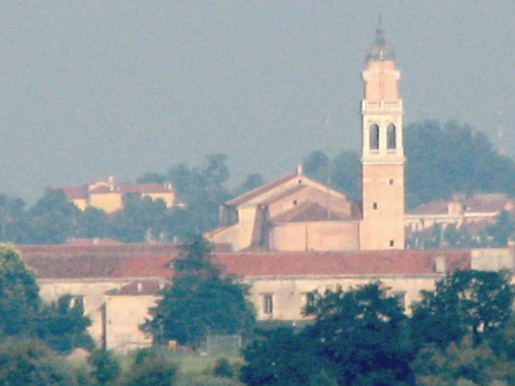 the old building has a tower with a cross on it