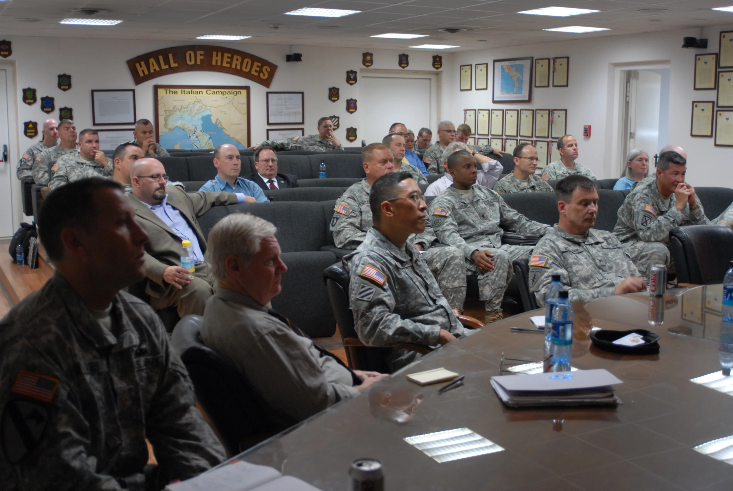 a group of men sitting around a conference table