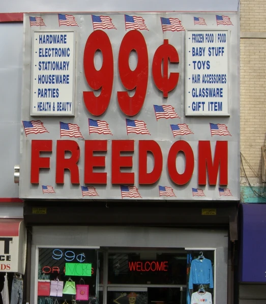 the front of a shoe store with a flag sign