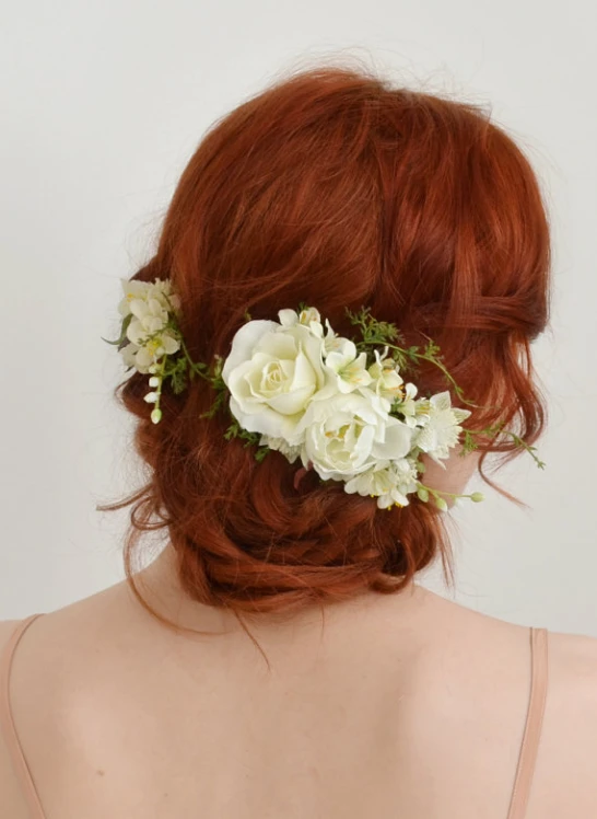 a girl with long hair with flowers in her hair