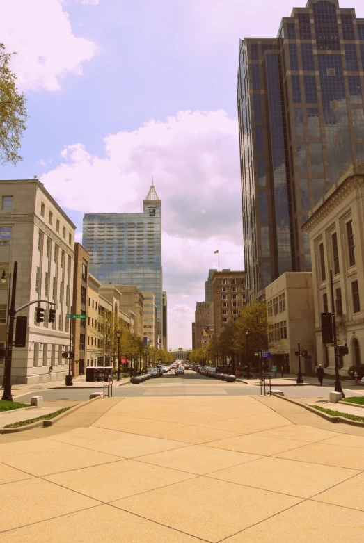 view of a city street with lots of tall buildings