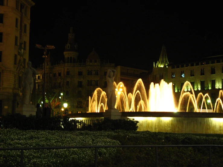 lighted fountain lit up in a very urban area