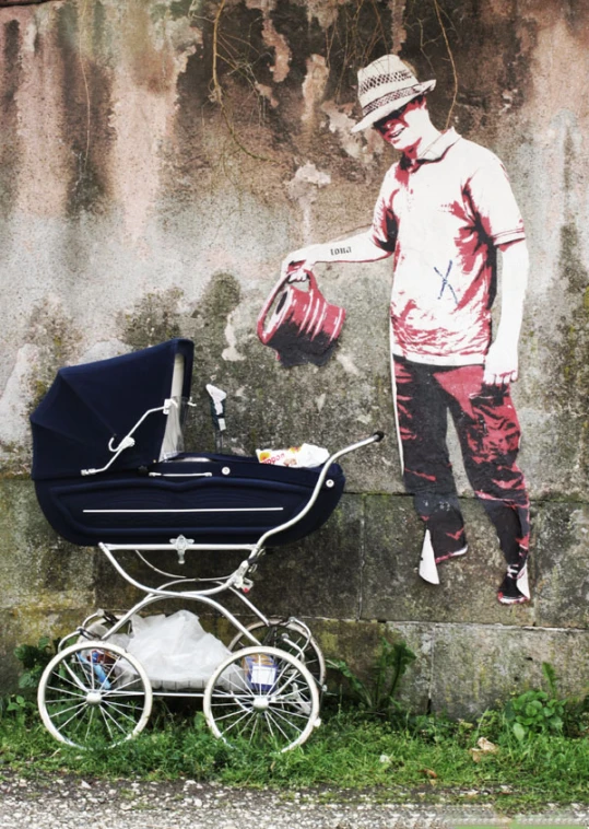 a man standing near a street with a baby carriage