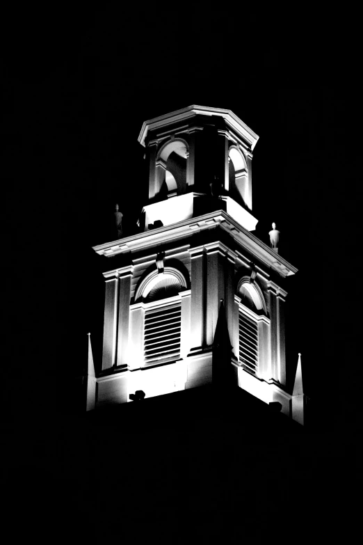 a black and white pograph of a clock tower