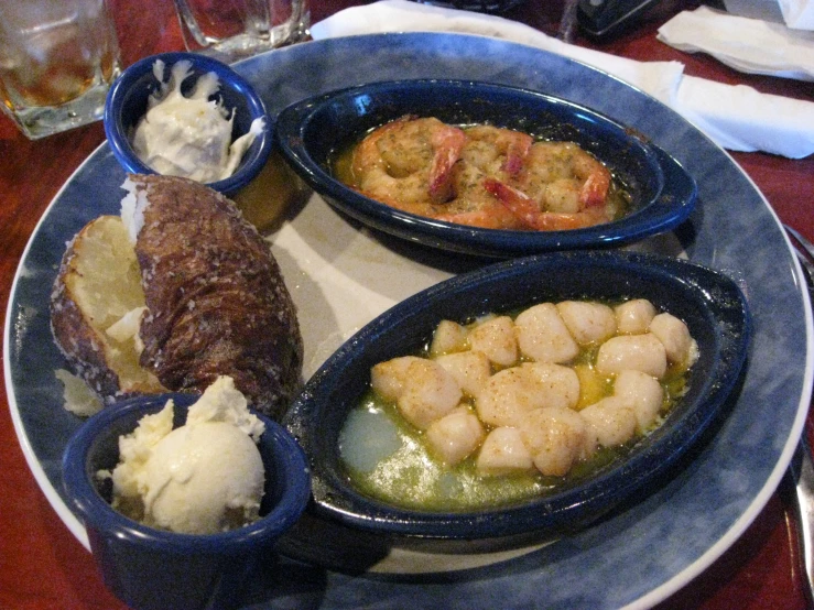 an assortment of foods served on plates on a table