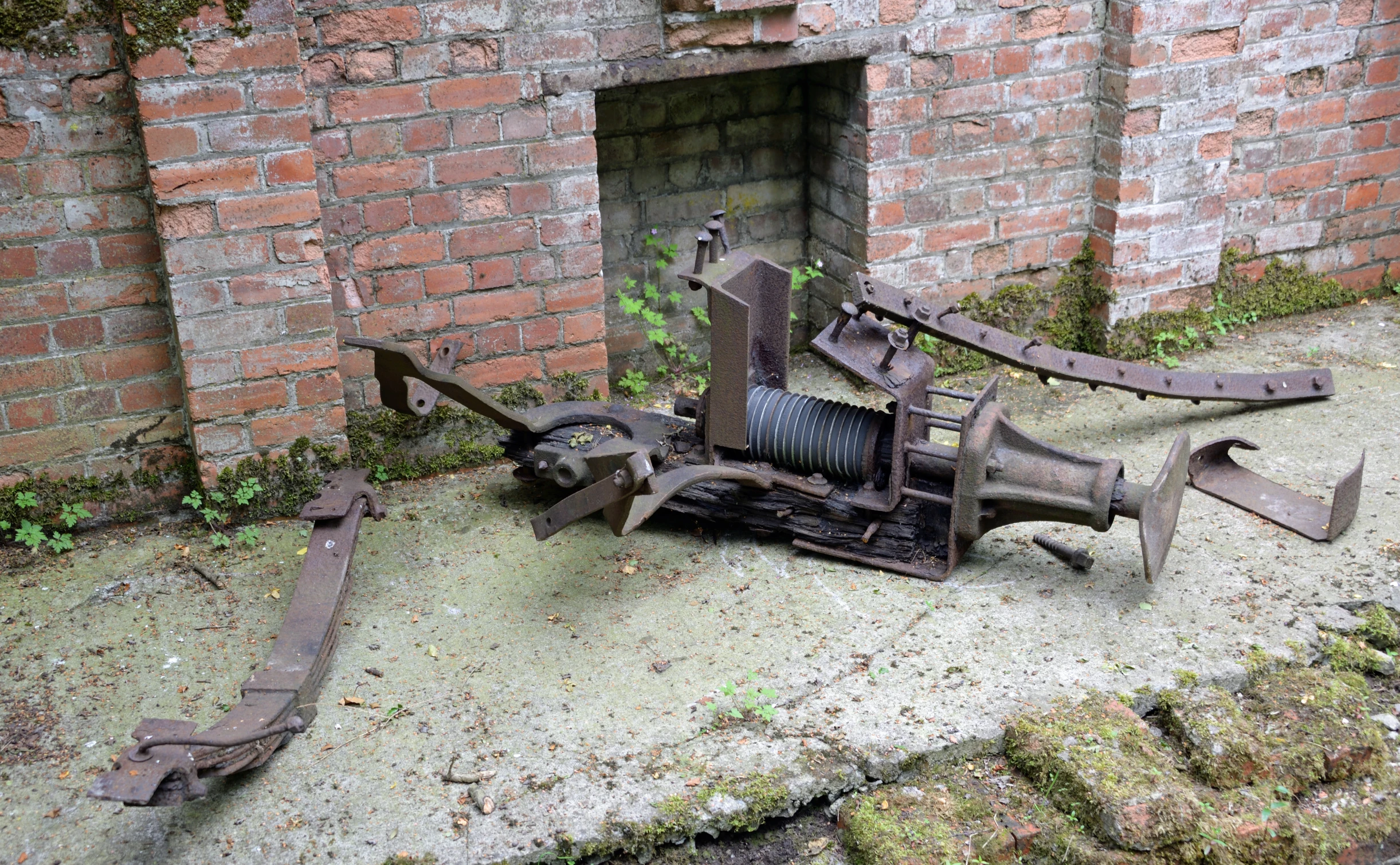 an image of a rusted out machine in the dirt