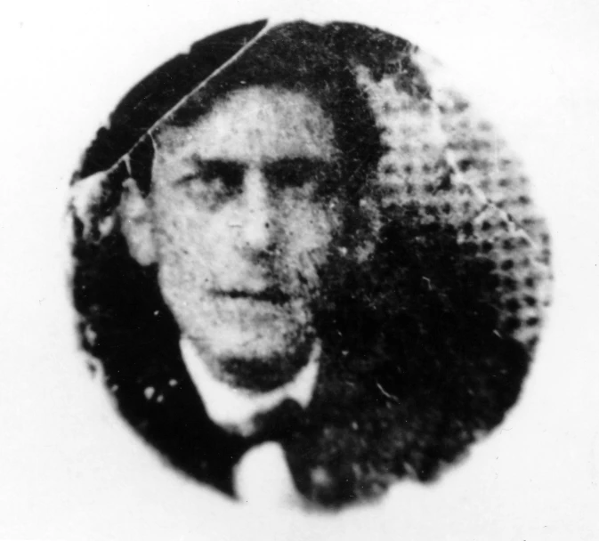 old time portrait of a man wearing a hat