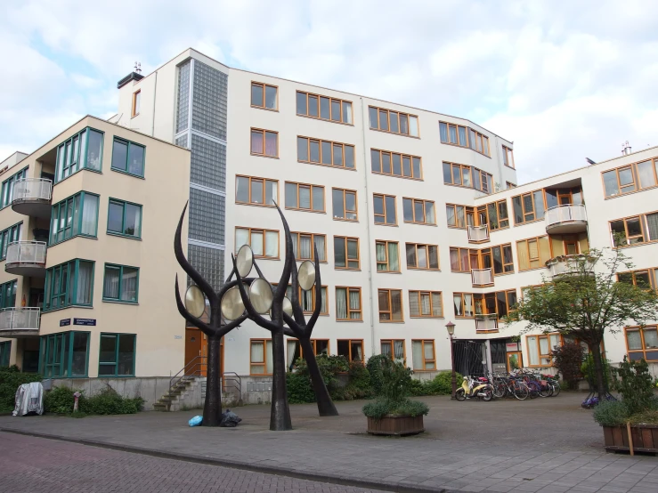 a building is shown with many metal sculptures