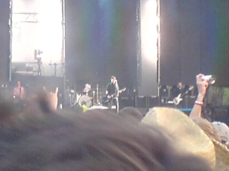 a view from behind the audience of a rock concert