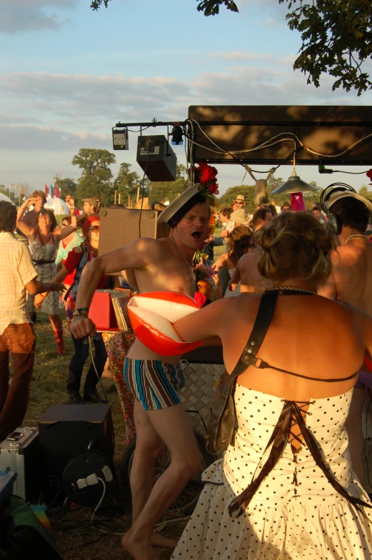 a couple of people that are dancing at a party