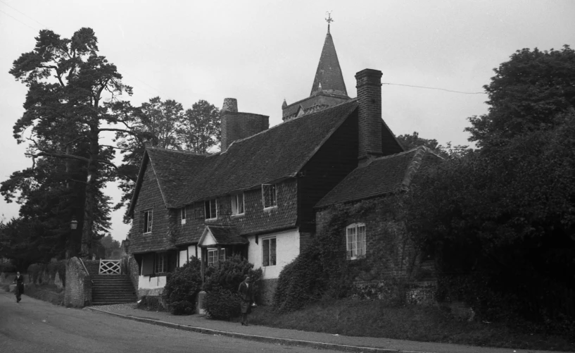 black and white po of building with roof pointed up