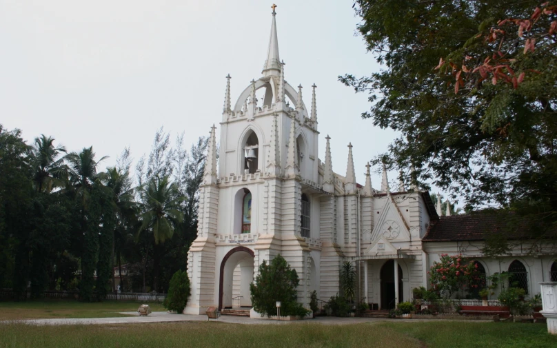 a white church building with a large steeple