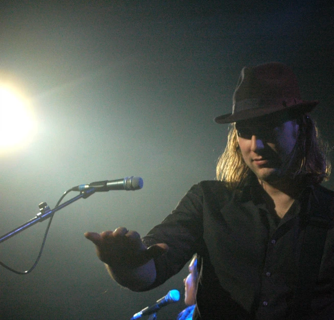 a man standing in front of a microphone with a mic