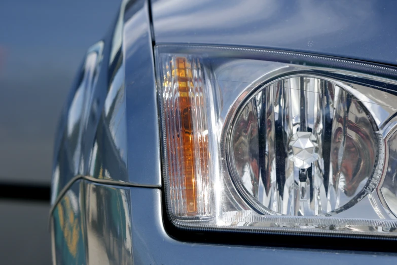 the side of a blue car with a black handle