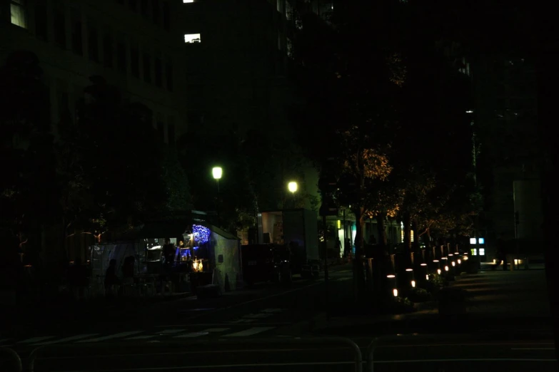 the lights on an intersection glow at night