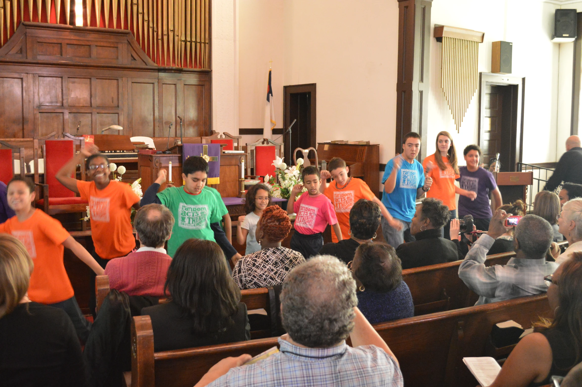 several people in front of the same church alter