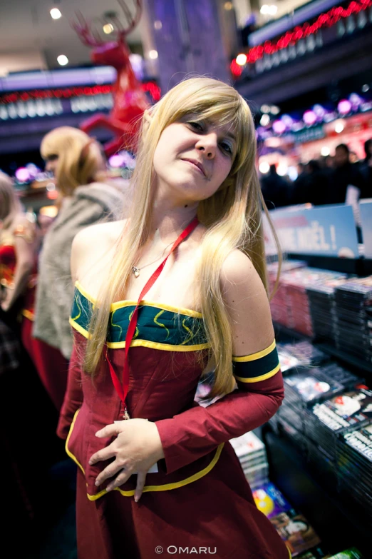 young woman posing for picture at convention event