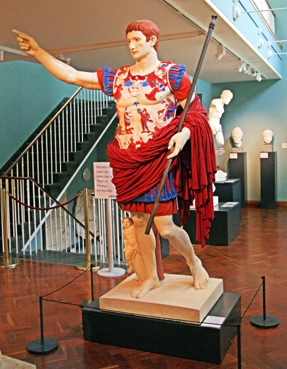 a statue of an individual with a umbrella in his hands