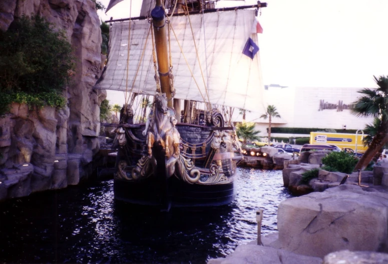 a pirate ship that is docked on a river