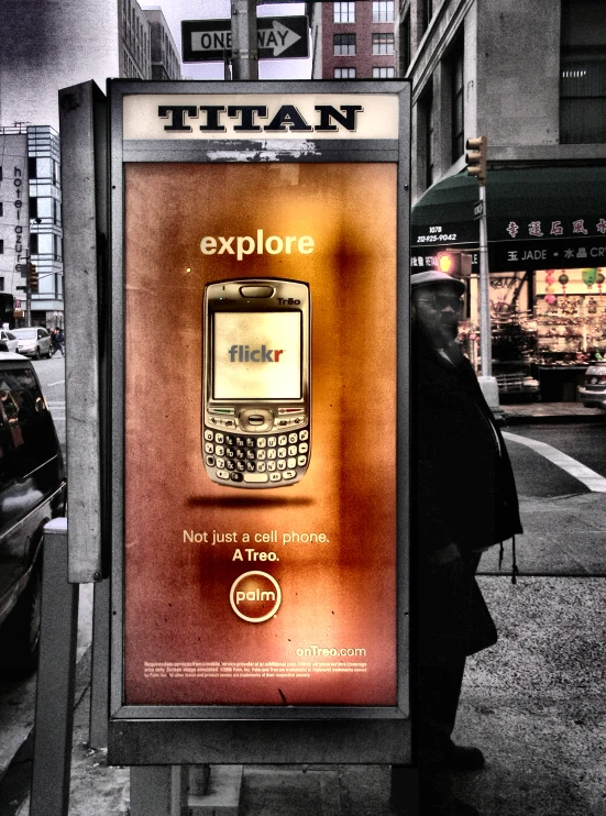 a poster on a metal frame that has an advertit of a smartphone