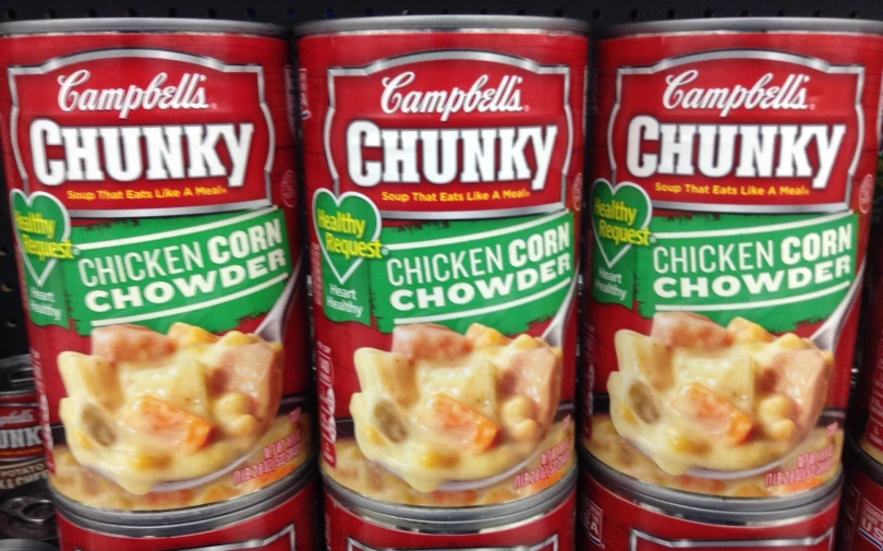 four cans of soup with chicken and chowders in them