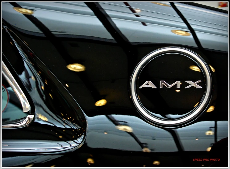 a car emblem with a circle of letters