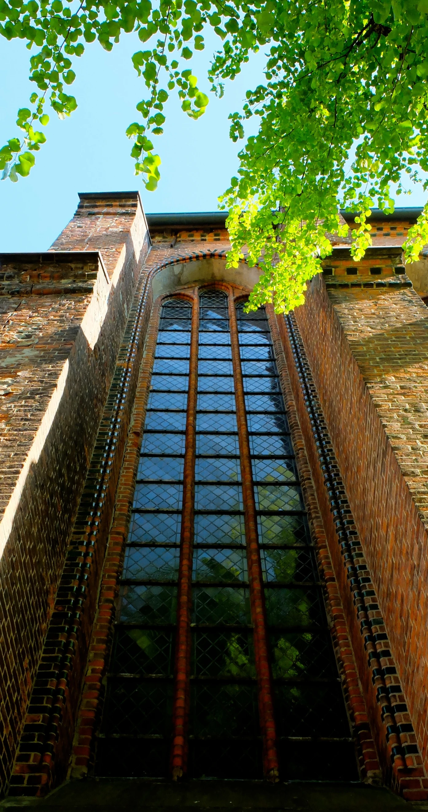 a tall brick building with lots of windows on it