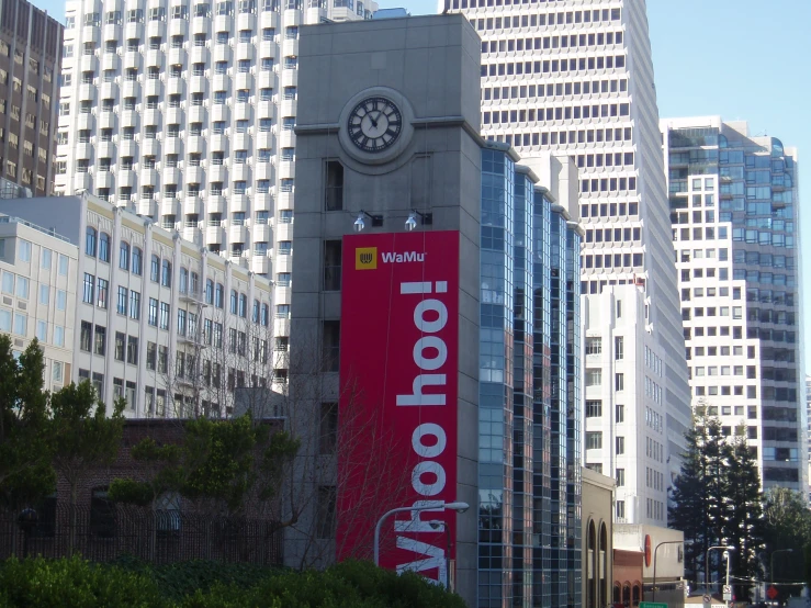 a tall clock tower sitting in the middle of a city