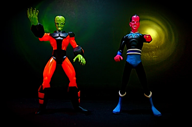 the two action figures are glowing brightly