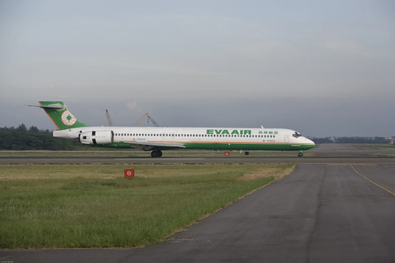 a large passenger jet sitting on top of an airport runway