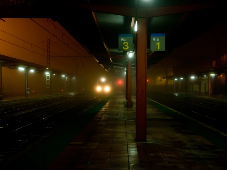 lights shining at an empty subway platform