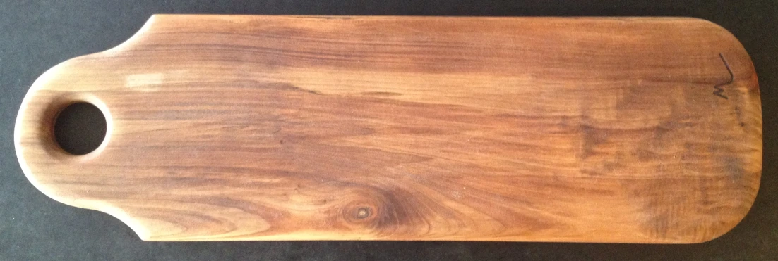 a wooden  board that has holes for 